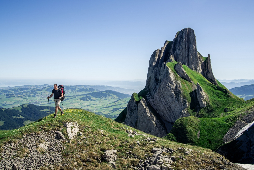 Cute Little Girl Hiking In Swiss Alps, Resting On A Rock And